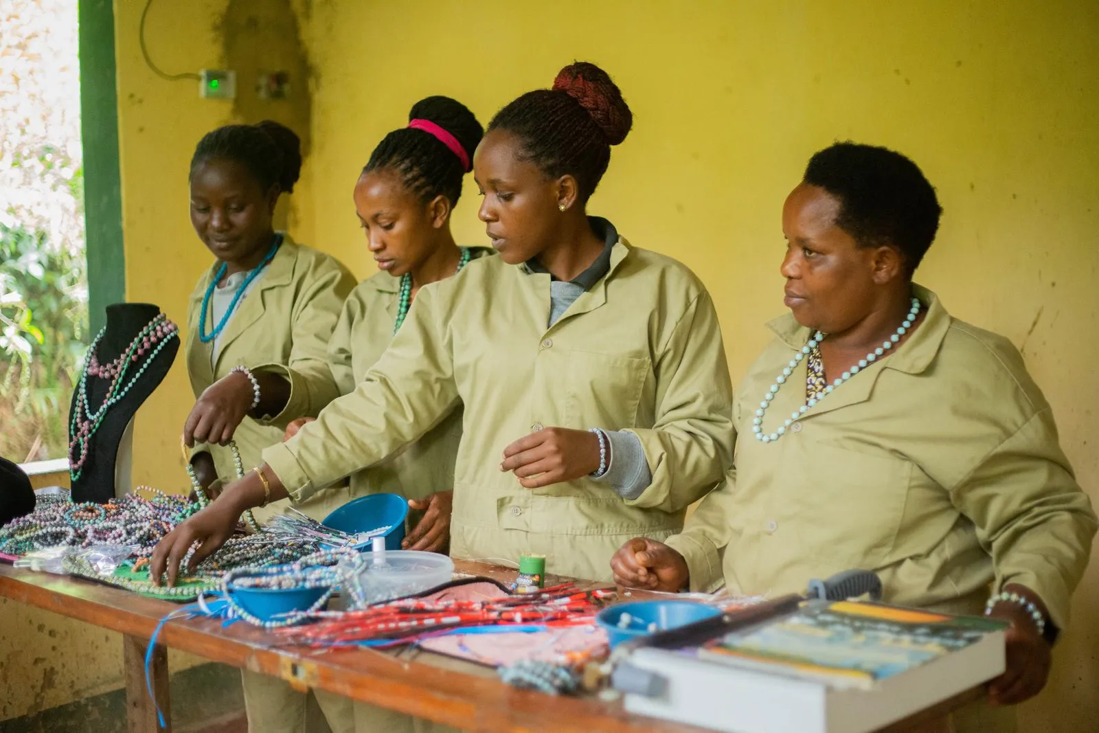 Women crafting beaded jewellery