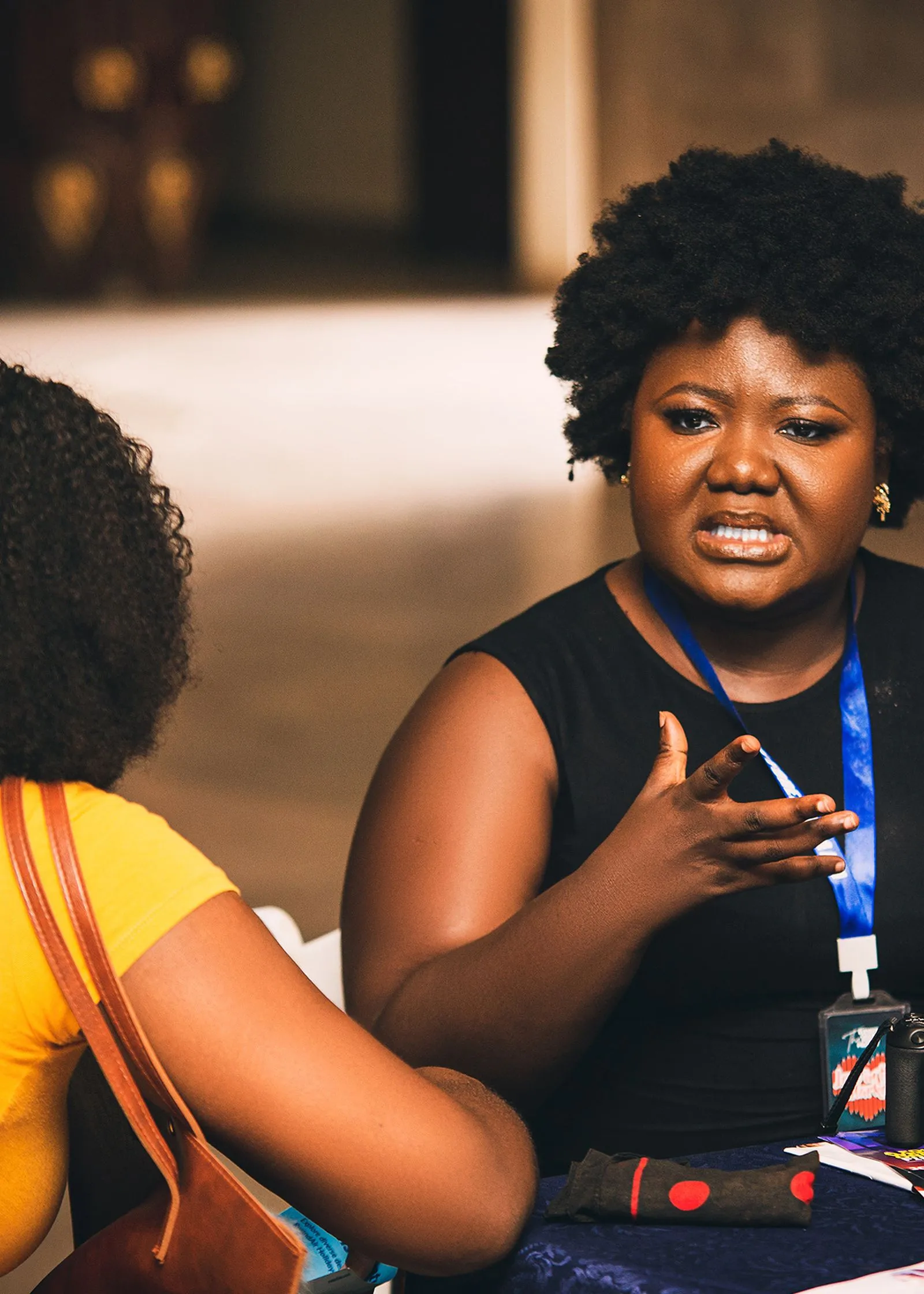 A woman speaking at a community dialogue