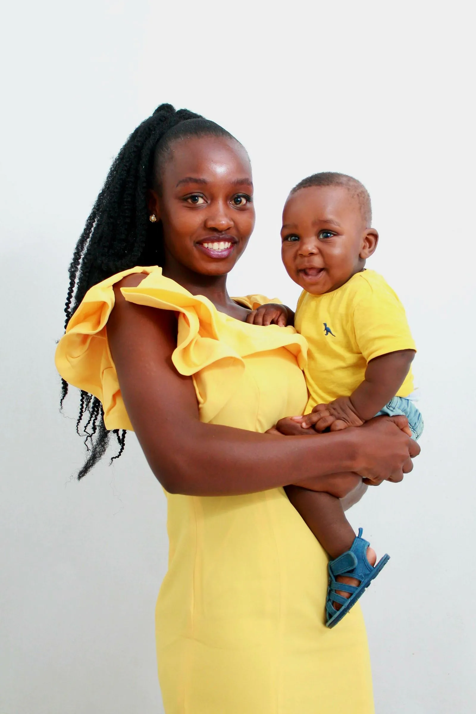 A smiling mother holding her child